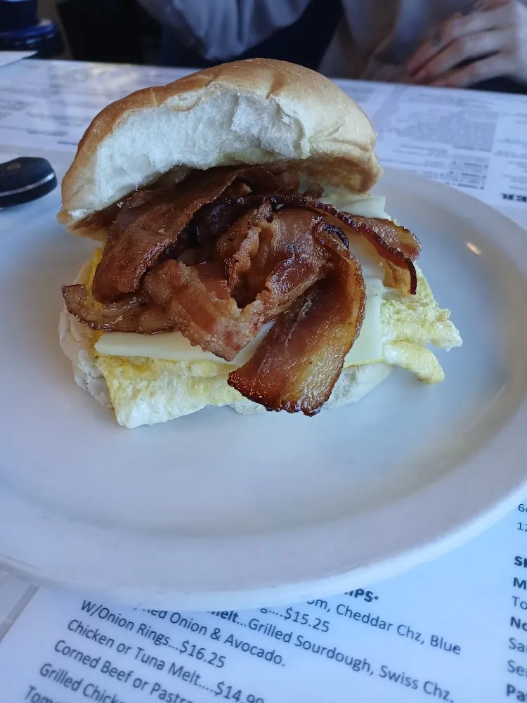 2 Scrmbeled Eggs with Bacon on a Buttered Grilled Hard Roll